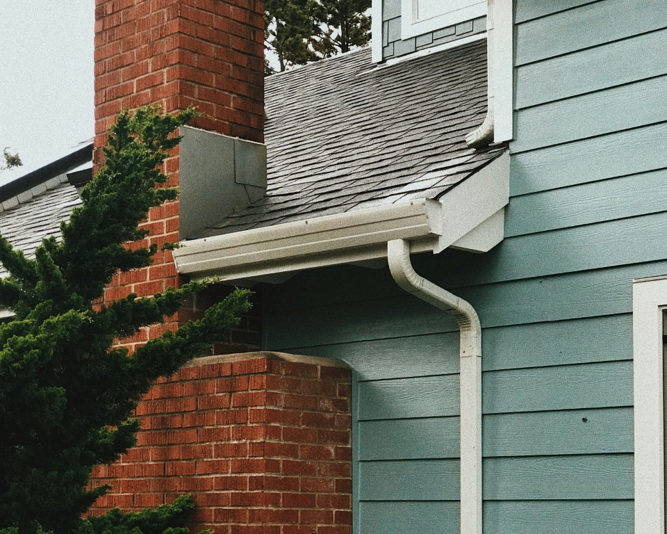 newly installed gutters on a cladded building