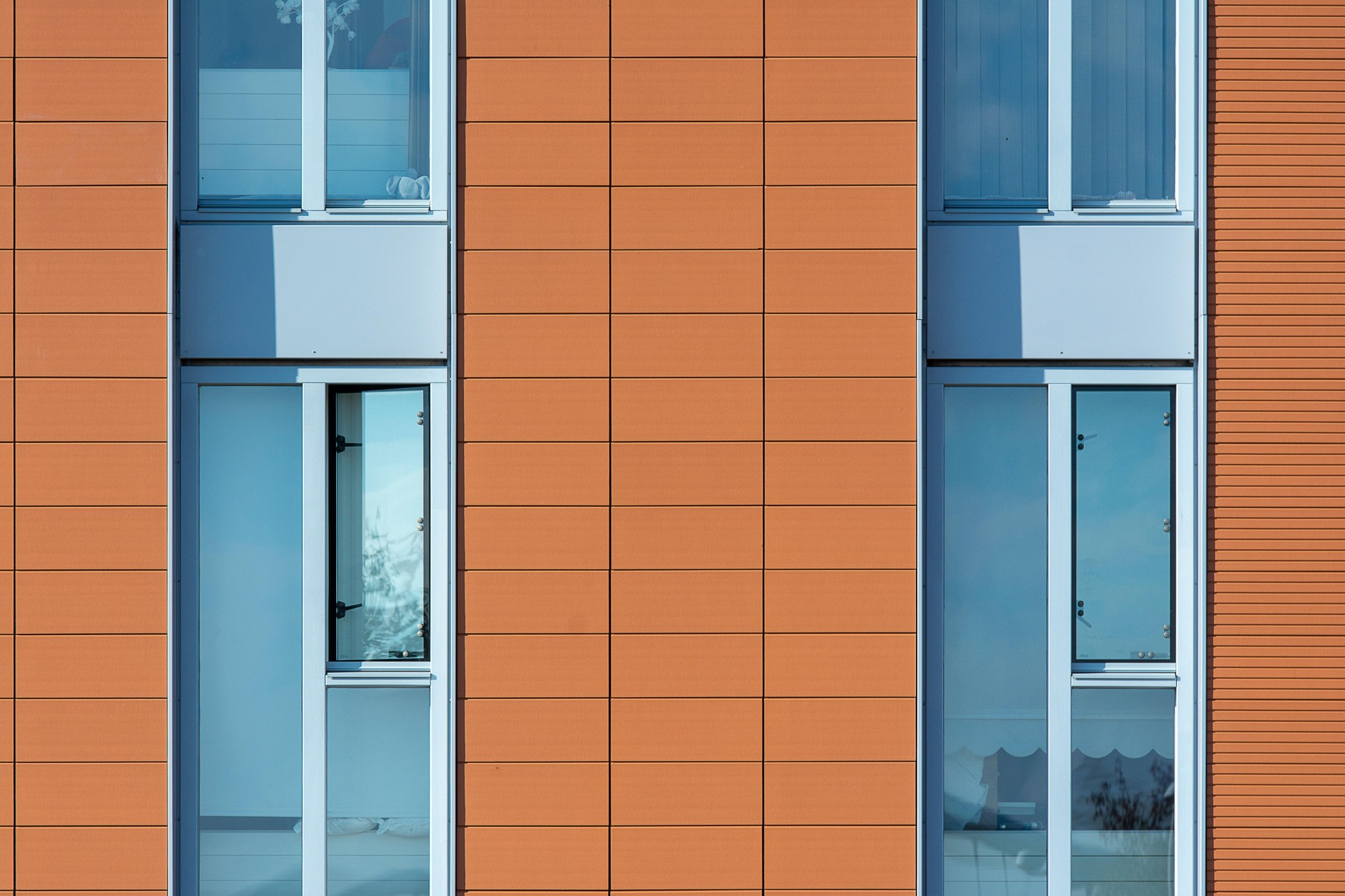 Red cladding on the side of a house